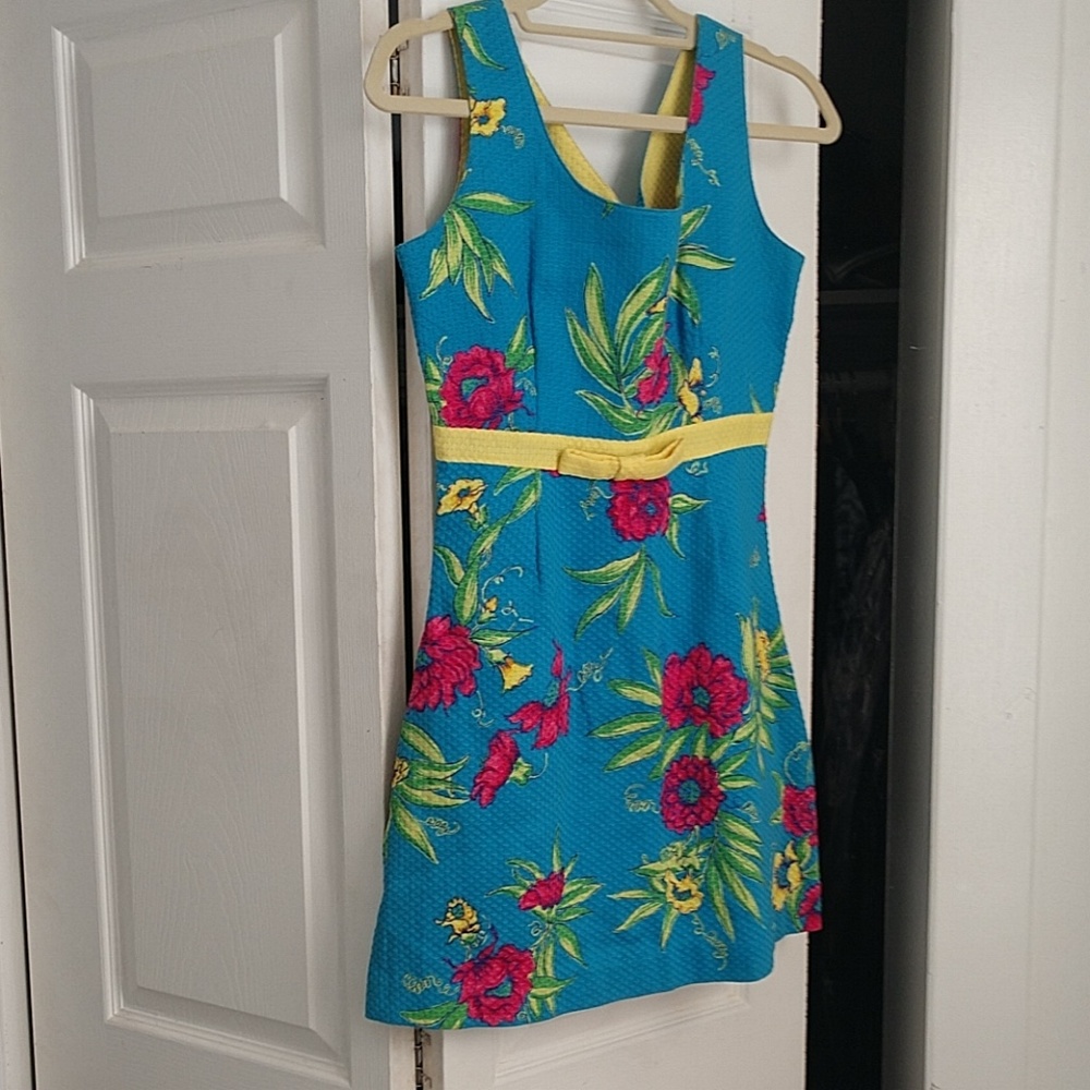 Dress 12 1/4 in across yellow ribbon